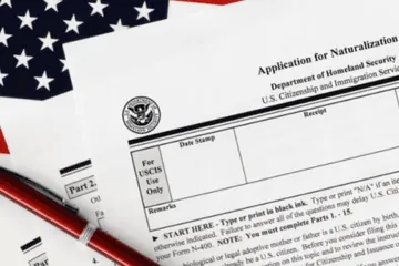 Person with hand on heart during naturalization